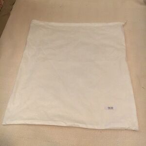 The Row white storage pull string bag